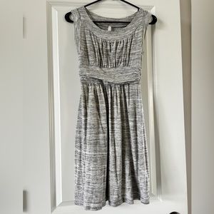 Gray sleeveless maternity dress.